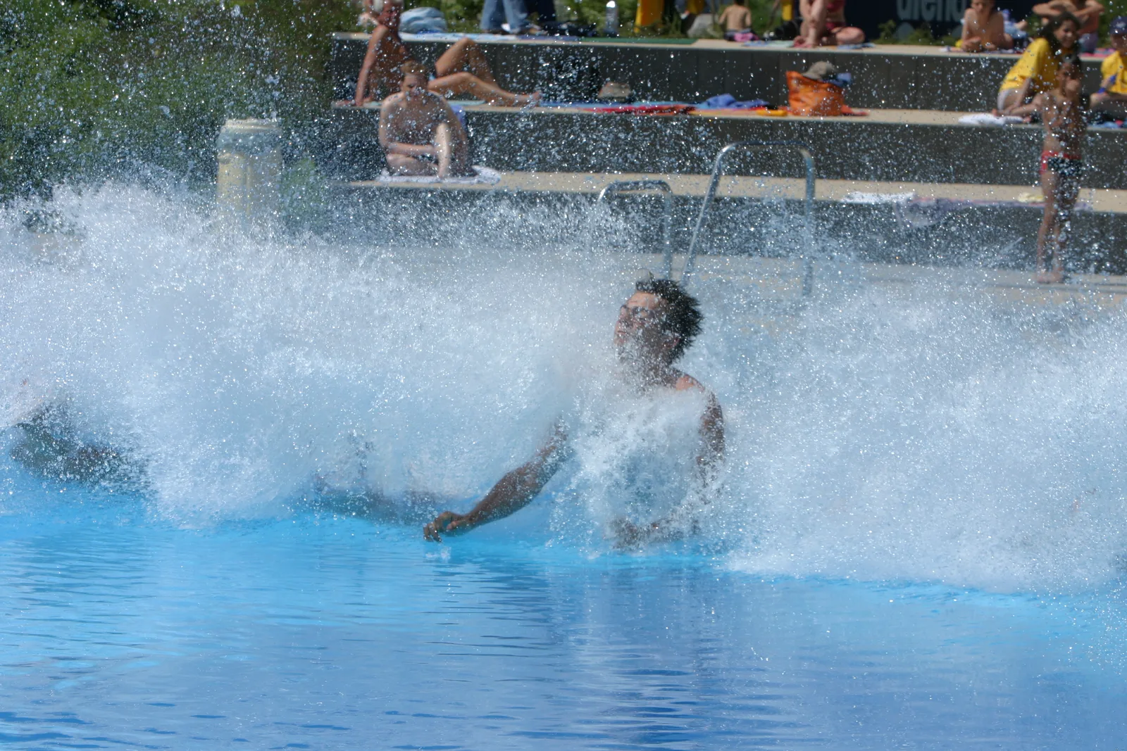 A team member surfacing in a burst of water, outdoor pool 2005.