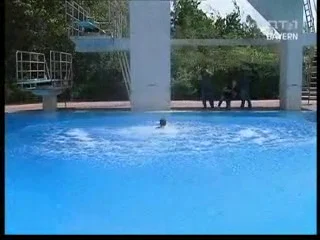 The diving tower, pool and water after a landing during joint training.