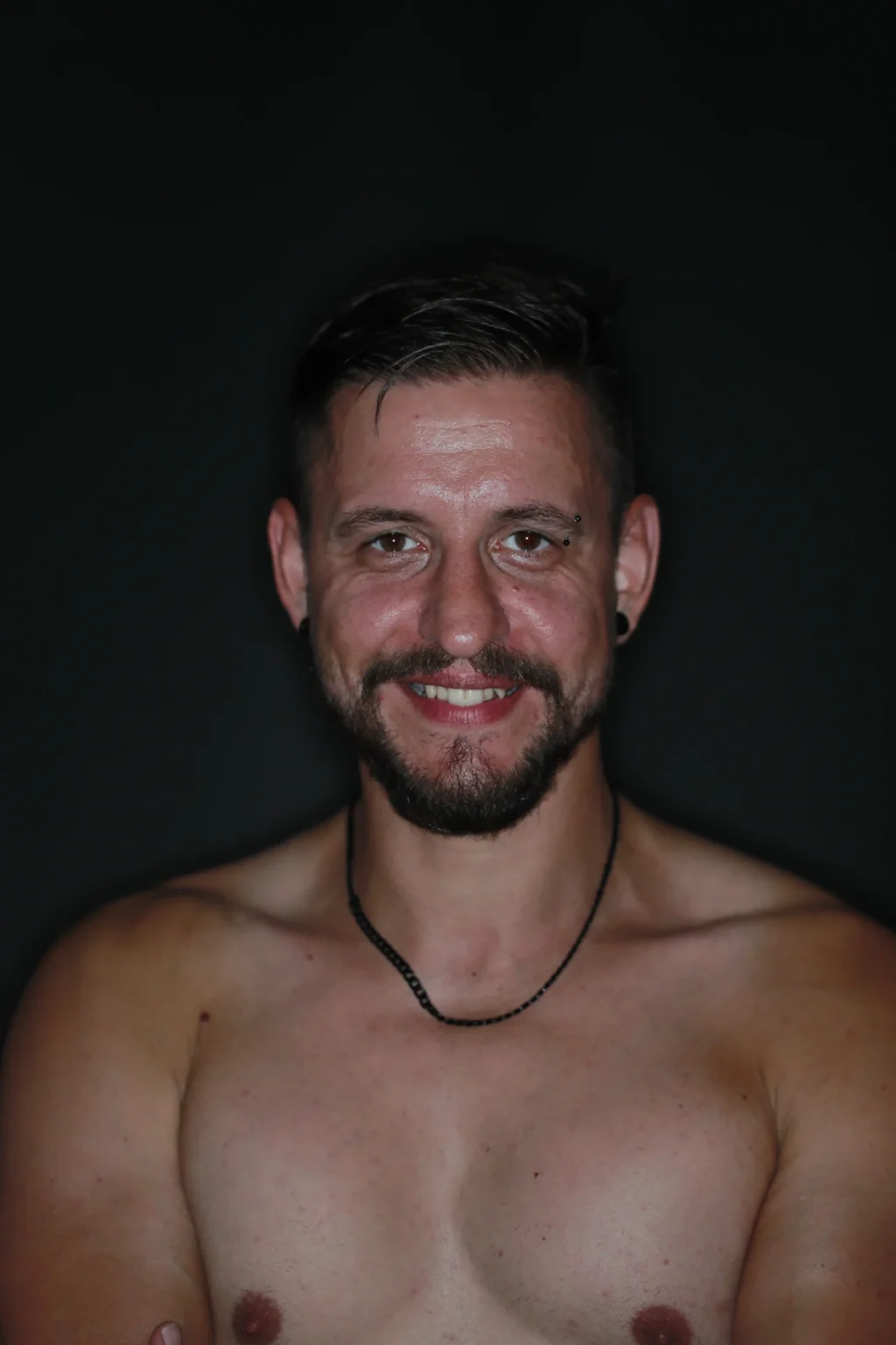 A smile against a dark backdrop · 27 July 2019
